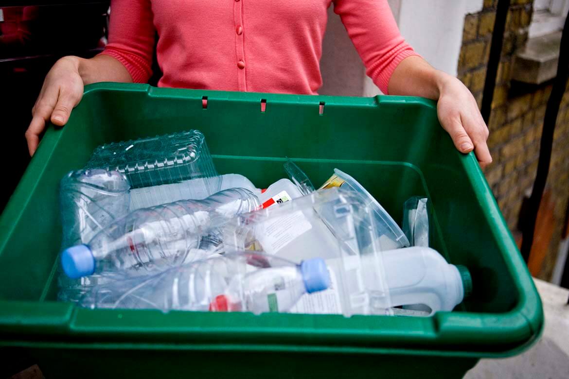 Plastics recycling - woman holding recycling box (1).jpg