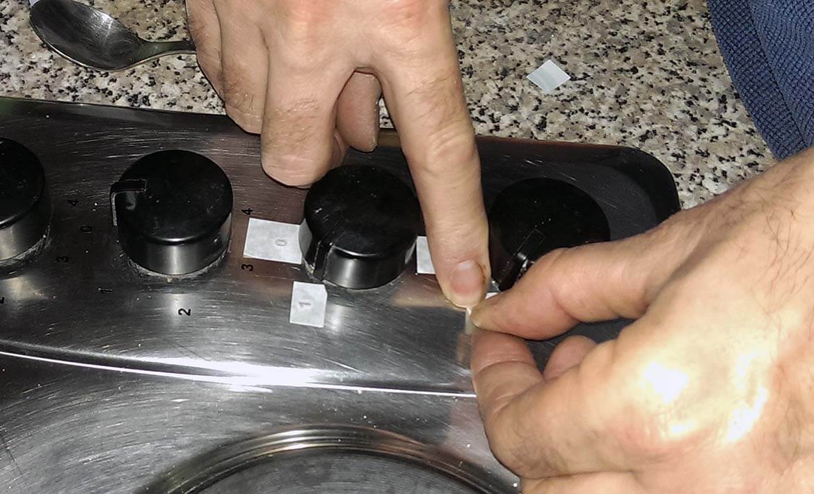 Repairing the stickers on an oven hob.jpg