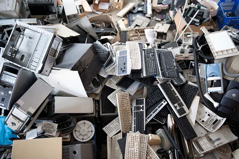 Photo of a pile of broken computer equipment