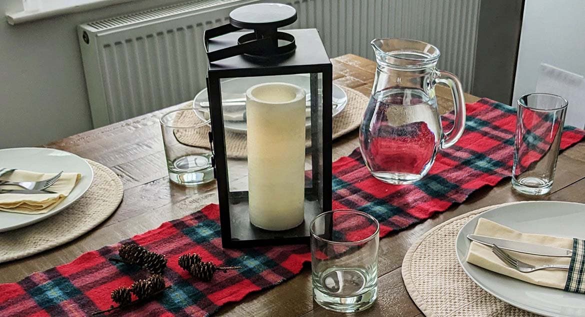 A table made up for Burns Night with a tartan table runner
