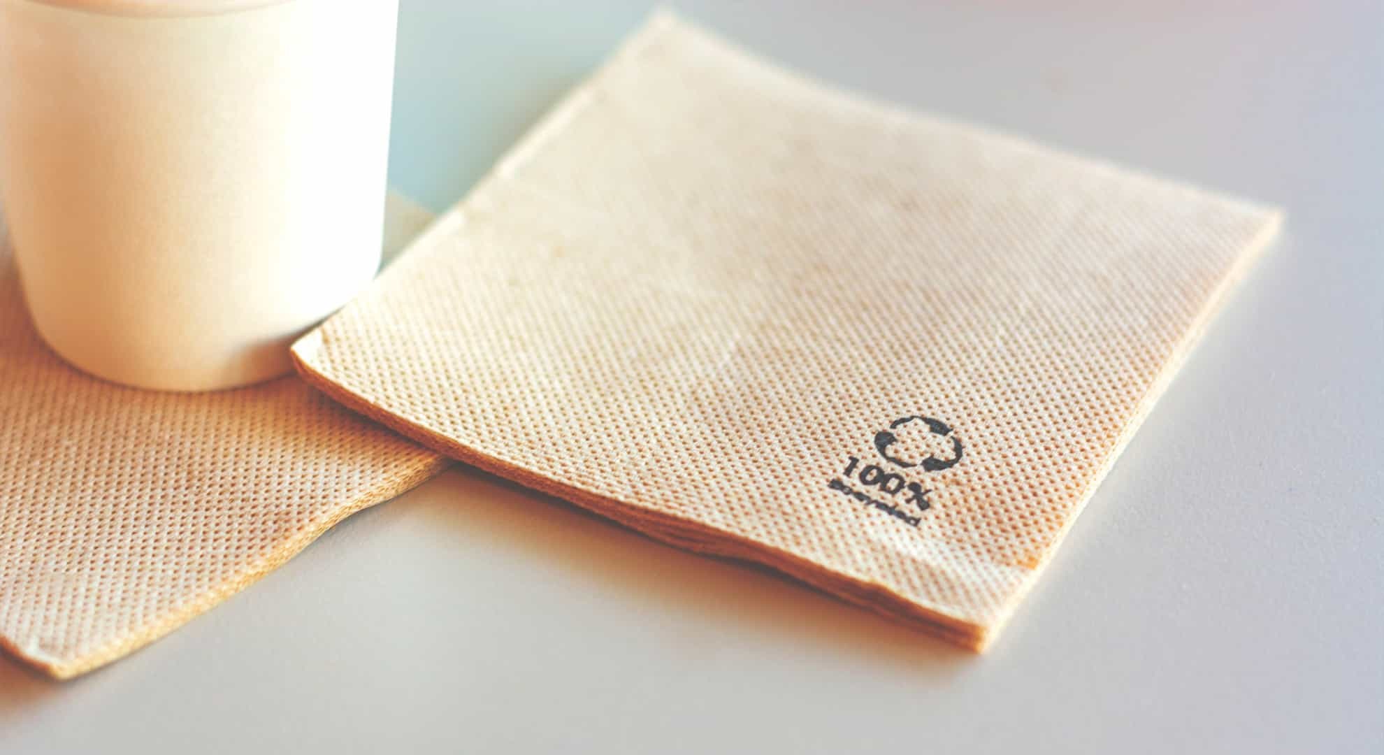 Disposable napkin made from recycled paper. 