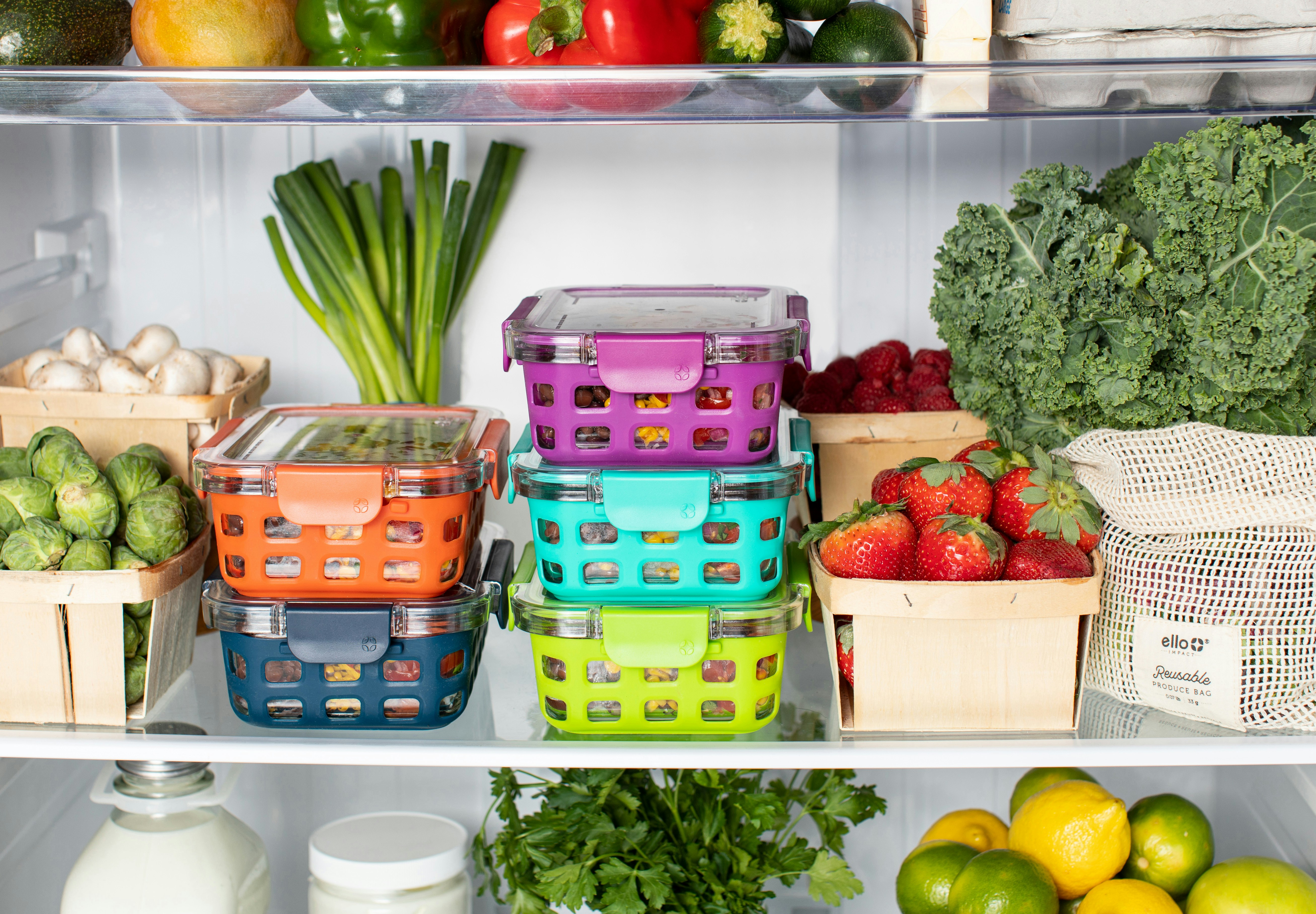 Refrigerator shelves stocked with fresh produce